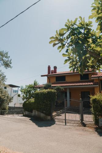 a house with a fence in front of it at Villa Desiderio - Trabocchi Coast - Fossacesia in Fossacesia