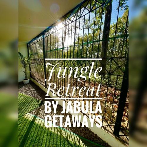 a sign that reads jungle retreat by jaguula gazania claws at The Jungle Retreat by Jabula Getaways in Dehradun