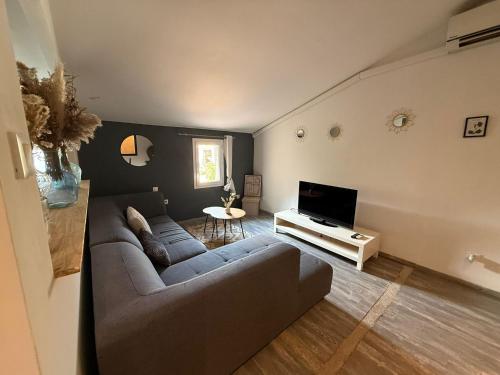 Χώρος καθιστικού στο Appart Cosy avec clim 80m2