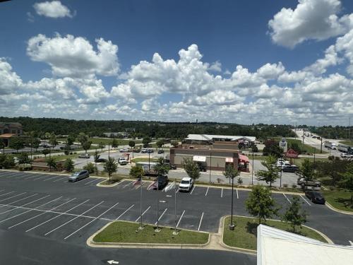 an aerial view of a parking lot at La Quinta by Wyndham Opelika Auburn in Opelika