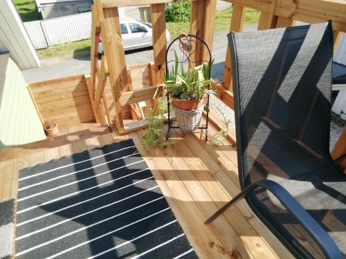 a deck with a staircase and a plant at Stuudio 7,Otepää linn 67404,Valgamaa in Otepää