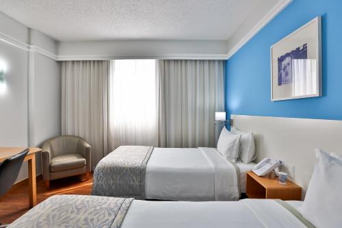 Cama o camas de una habitación en Slaviero São Paulo Downtown