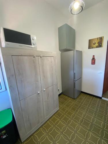 a room with a cabinet and a refrigerator at Casa Rebecca in San Martino