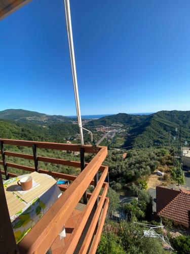 a view from the balcony of a house with mountains in the background at Casa Rebecca in San Martino