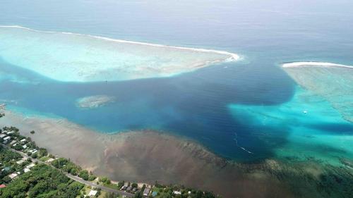 an aerial view of a body of water at Happy T Beach House in Haapiti