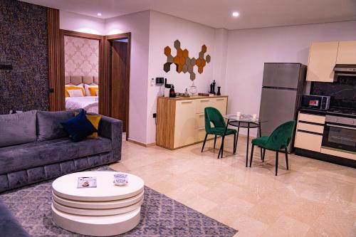 a living room with a couch and a kitchen at R102-3-4 Amazing apartments in Belvedere with Breathtaking Ocean and Street Views in Casablanca