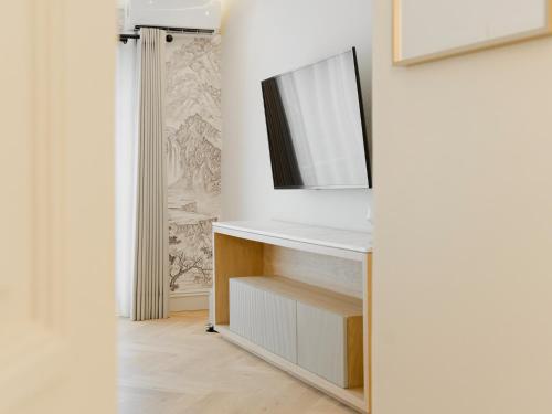 a bathroom with a mirror and a white cabinet at Hotel Maria Camille in San Miguel de Allende