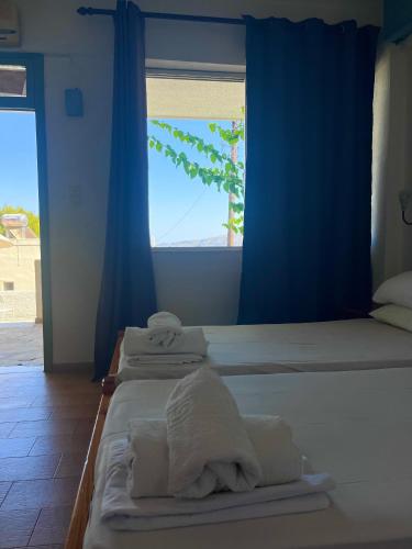 Ένα ή περισσότερα κρεβάτια σε δωμάτιο στο Fedra Apartments