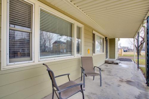 two chairs sitting on the porch of a house at Fruita Vacation Rental Walk to Downtown! in Fruita
