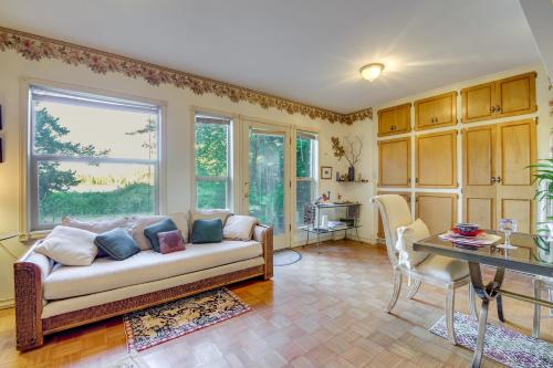 a living room with a couch and a table at Less Than 1 Mi to Jefferson Healthcare Nurse-Ready Rental in Port Townsend