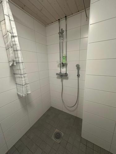 a bathroom with a shower with a shower at Modern studio, good location, free parking in Kuopio