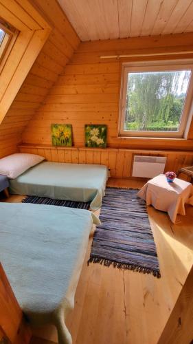 Postel nebo postele na pokoji v ubytování House with sauna near of lake Viljandi