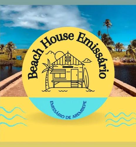 a sign for a vacation house embassy in the ocean at Beach House in Camaçari