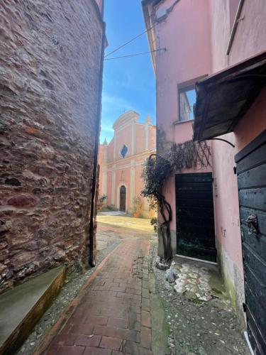 an alley between two buildings with a building in the background at Bia Apartments pt in Monte Marcello