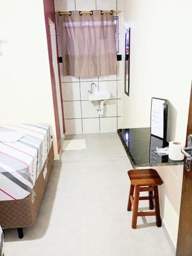 Una cama o camas en una habitación de Hotel Faf's Interlagos - SP
