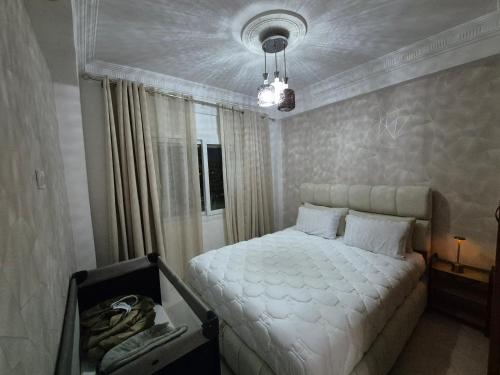 Ένα ή περισσότερα κρεβάτια σε δωμάτιο στο Residence Achakar Tanger
