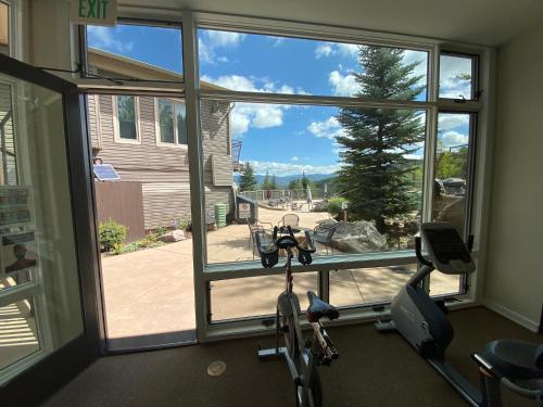 a room with a gym with a window and a bike at Timberline Condominiums 1 Bedroom plus Loft Deluxe Unit A3C in Snowmass Village