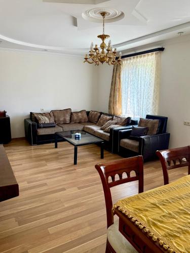 a living room with a couch and a table at Dream house in Yeghegnadzor