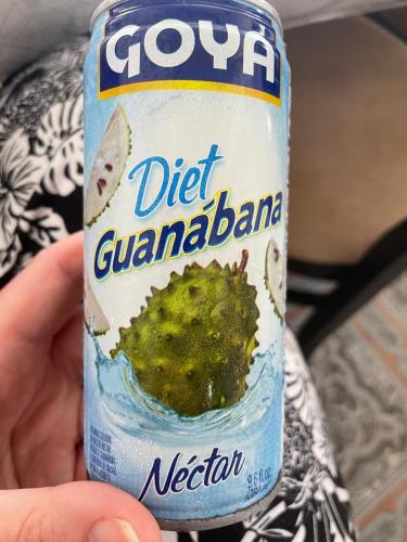 a person holding a diet can of guamamine at Arecibo's country cottage in Arecibo