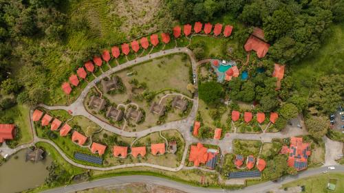 an overhead view of a house with red roofs at Montaña de fuego Mountain Resort & Spa in Fortuna
