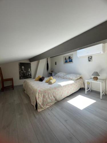 a bedroom with a large bed in a room at Villa Les Chênes - Golfe de Saint-Tropez Experience in Port Grimaud