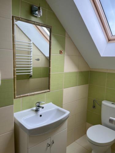 Łazienka w obiekcie Apartamenty Grzybowo
