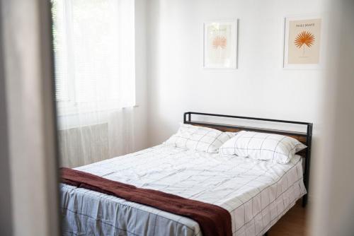 Ένα ή περισσότερα κρεβάτια σε δωμάτιο στο Apartman CornerOne