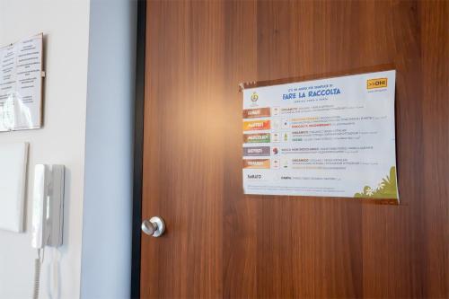 a sign on the door of a hotel in nigeria at A Casa di Falco in Mondragone