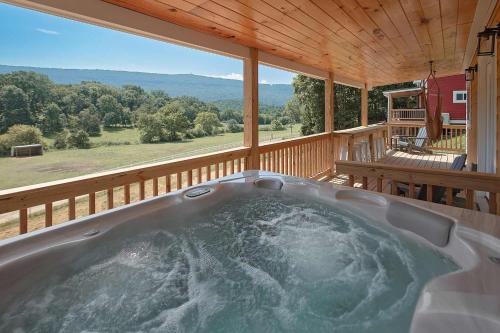 a hot tub on the deck of a cabin at The Honeycomb House in Chattanooga