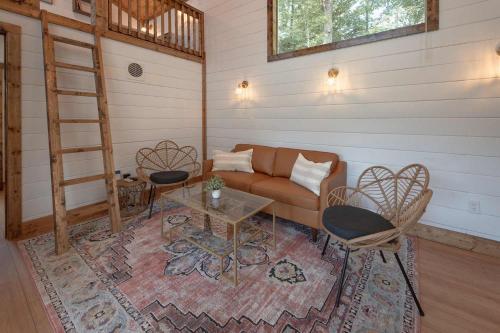a living room with a couch and a table at The Honeycomb House in Chattanooga