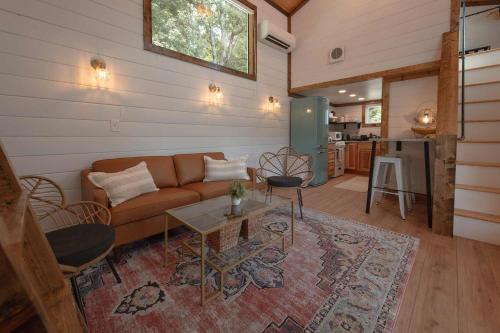 a living room with a couch and a table at The Honeycomb House in Chattanooga