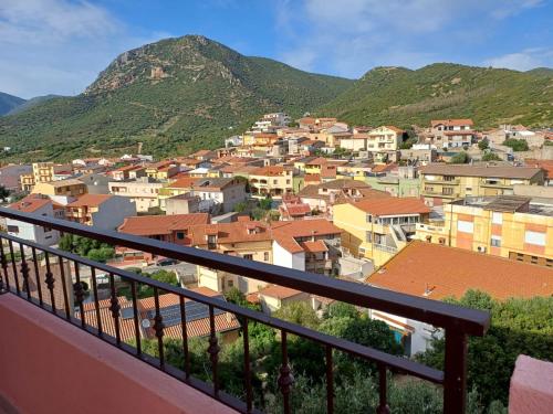 a view from a balcony of a town with mountains at Dimora mediterranea Fontanamare in Gonnesa
