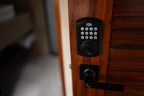 a close up of a door handle on a wooden door at Casa TzinTzun in Temalhuacán
