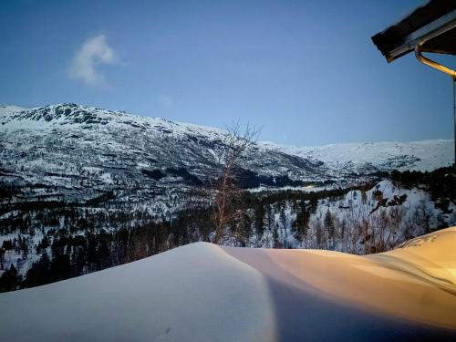 a view of a snow covered mountain from a ski lodge at Stylish Cabin In Scenic Surroundings in Skare