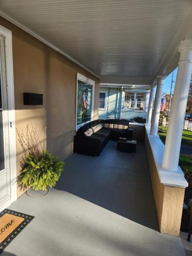 a living room with a couch and a table at The Fairview in Peabody