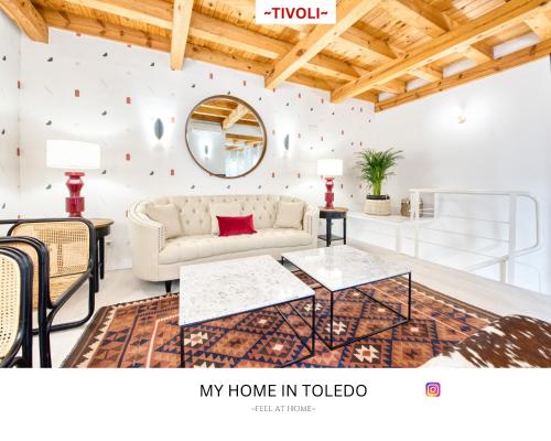 a living room with a couch and a table at -TÍVOLI- by myhomeintoledo in Toledo