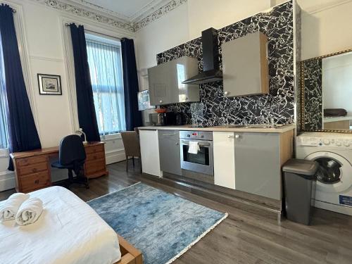 Ένα ή περισσότερα κρεβάτια σε δωμάτιο στο Glasgow South Studios