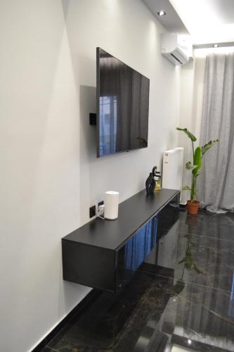 a bathroom with a black counter and a mirror at kaleos in Nea Chili