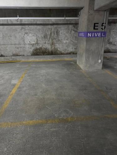 an empty parking garage with a street sign on it at Cozy apartment, all amenities in Mexico City