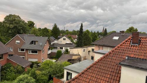 a group of houses in a city with roofs at Über den Dächern im Vier Vorne in Gütersloh