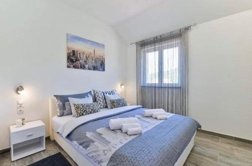 Ένα ή περισσότερα κρεβάτια σε δωμάτιο στο Apartments Ana