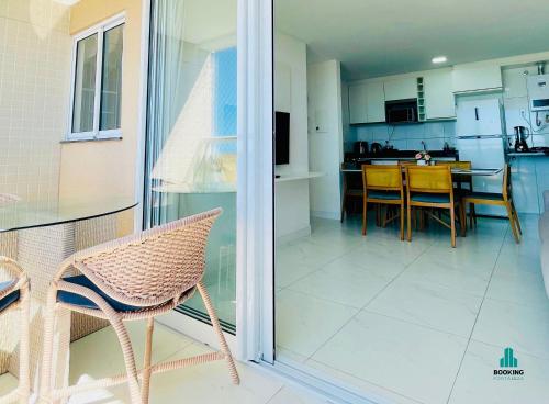 a kitchen and dining room with a table and chairs at Aquarius Style by Holiday Stays in Fortaleza