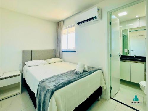 a hotel room with a bed and a bathroom at Aquarius Style by Holiday Stays in Fortaleza