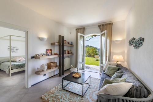 a living room with a couch and a table at Portofino Riviera Luxury Villa-Pool,Garden,Parking in Zoagli