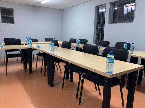 a row of tables with bottles of water on them at GMC-facilities in Centurion