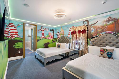 a bedroom with two beds and a wall with a mural at 1021 Fantasy in Davenport