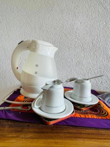 a tea set sitting on top of a table at Casa Dibulla Hotel Boutique in Dibulla