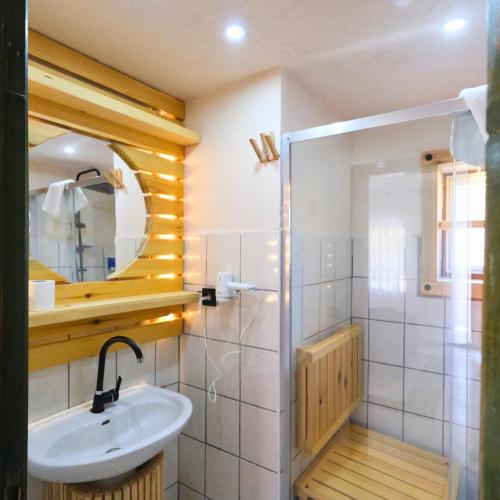 a bathroom with a sink and a mirror at Club Mel Holiday in Ortaca