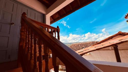 a wooden staircase on a house with a view at Aura Hotel Parque Barichara By Infinity in Barichara