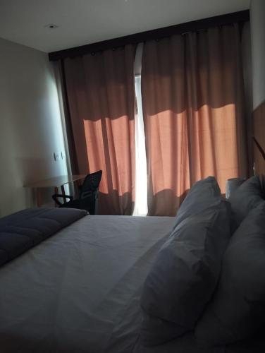 Postel nebo postele na pokoji v ubytování Apartamento Flat Itaboraí - Edifício Hélix